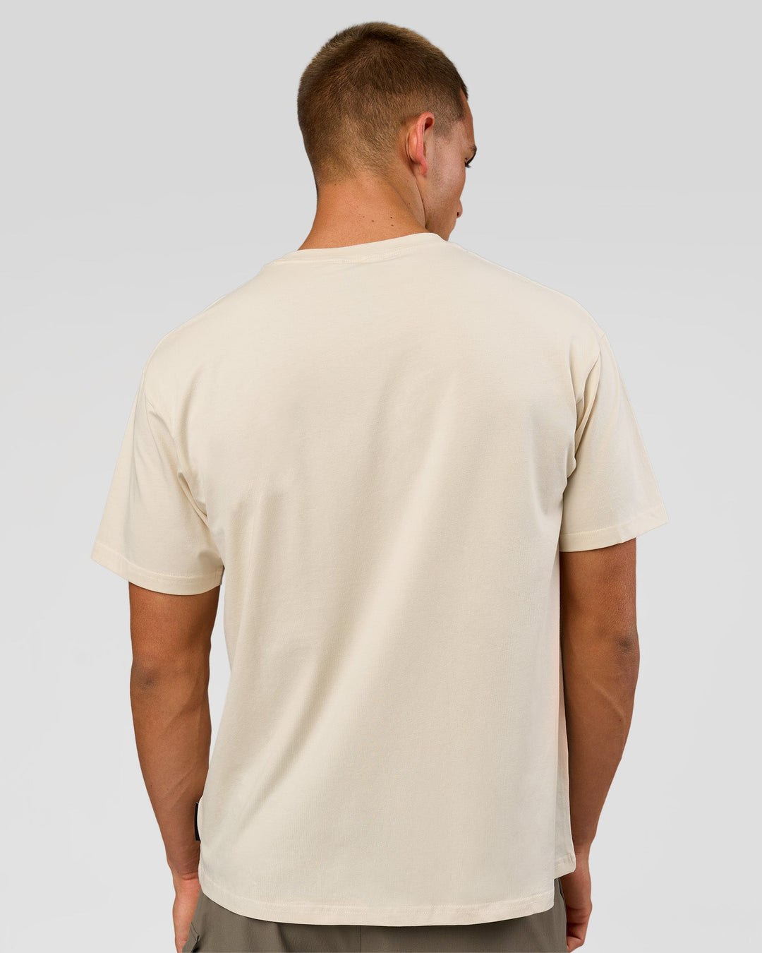 Man wearing VS1 Enjoy The Journey FLXCotton Oversize Tee - Vanilla Bean | Model:Albert | Size:M - view 7
