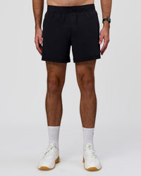 Man wearing Rep+ 5” Training Short - Black | Model:Alex | Size:M