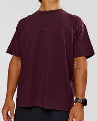 Man wearing VS26 1% Better FLXCotton Oversize Tee - Cherry Lacquer-Off White | Model:George | Size:M | Thumbnail Index: 9