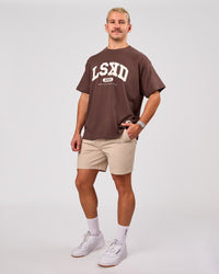 Man wearing Varsity EST Heavyweight Oversized Tee  - Cocoa Powder-Off White | Model:Jaiden | Size:M | Thumbnail Index: 5