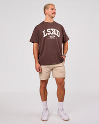 Man wearing Varsity EST Heavyweight Oversized Tee  - Cocoa Powder-Off White | Model:Jaiden | Size:M | Thumbnail Index: 4