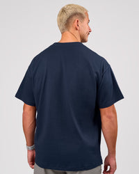 Man wearing Varsity EST Heavyweight Oversized Tee  - Future Navy-White | Model:Jaiden | Size:M | Thumbnail Index: 9