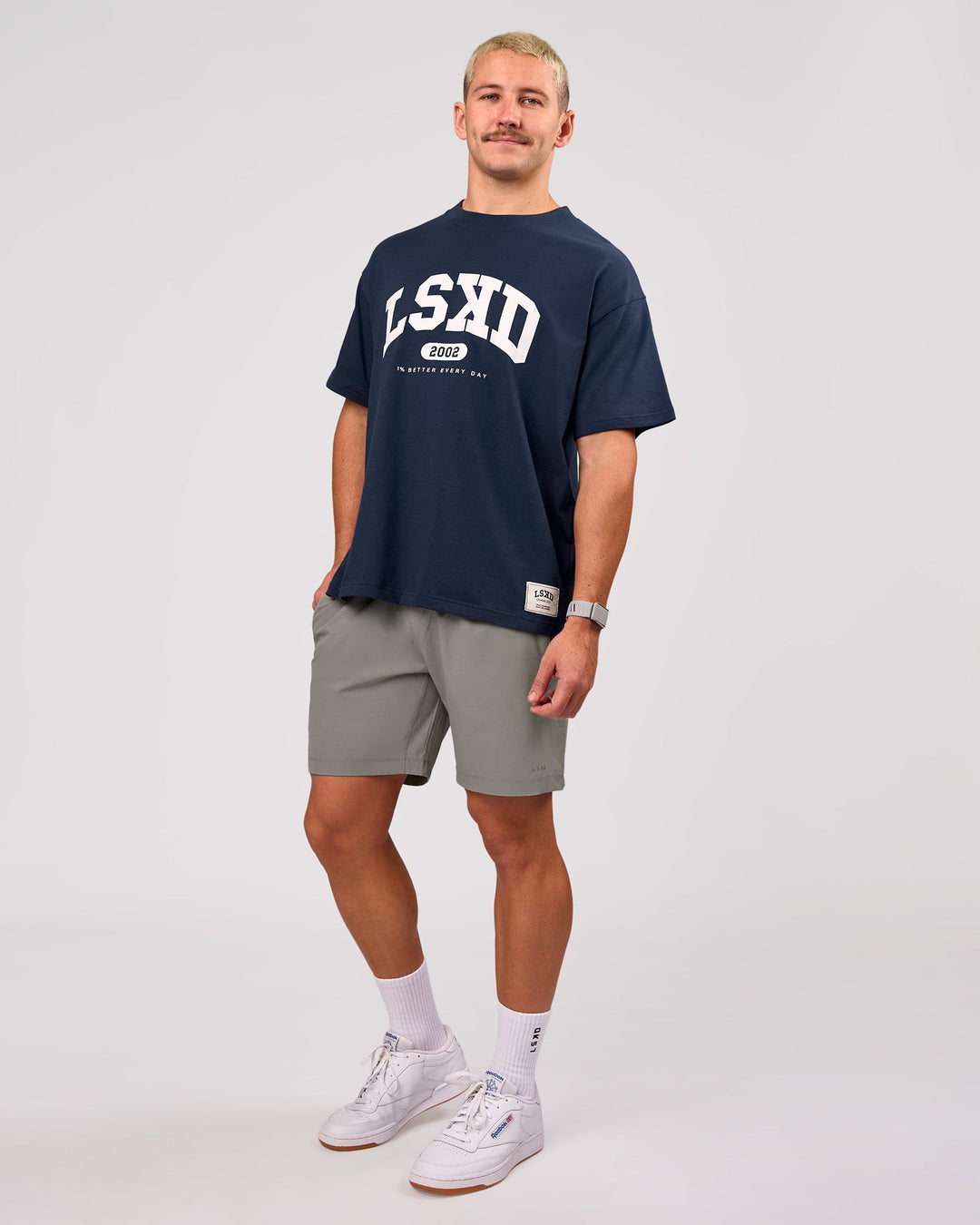 Man wearing Varsity EST Heavyweight Oversized Tee  - Future Navy-White | Model:Jaiden | Size:M - view 11