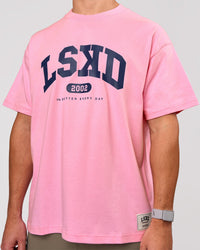 Man wearing Varsity EST Heavyweight Oversized Tee  - Pink Rose-Future Navy | Model:Jaiden | Size:M | Thumbnail Index: 9