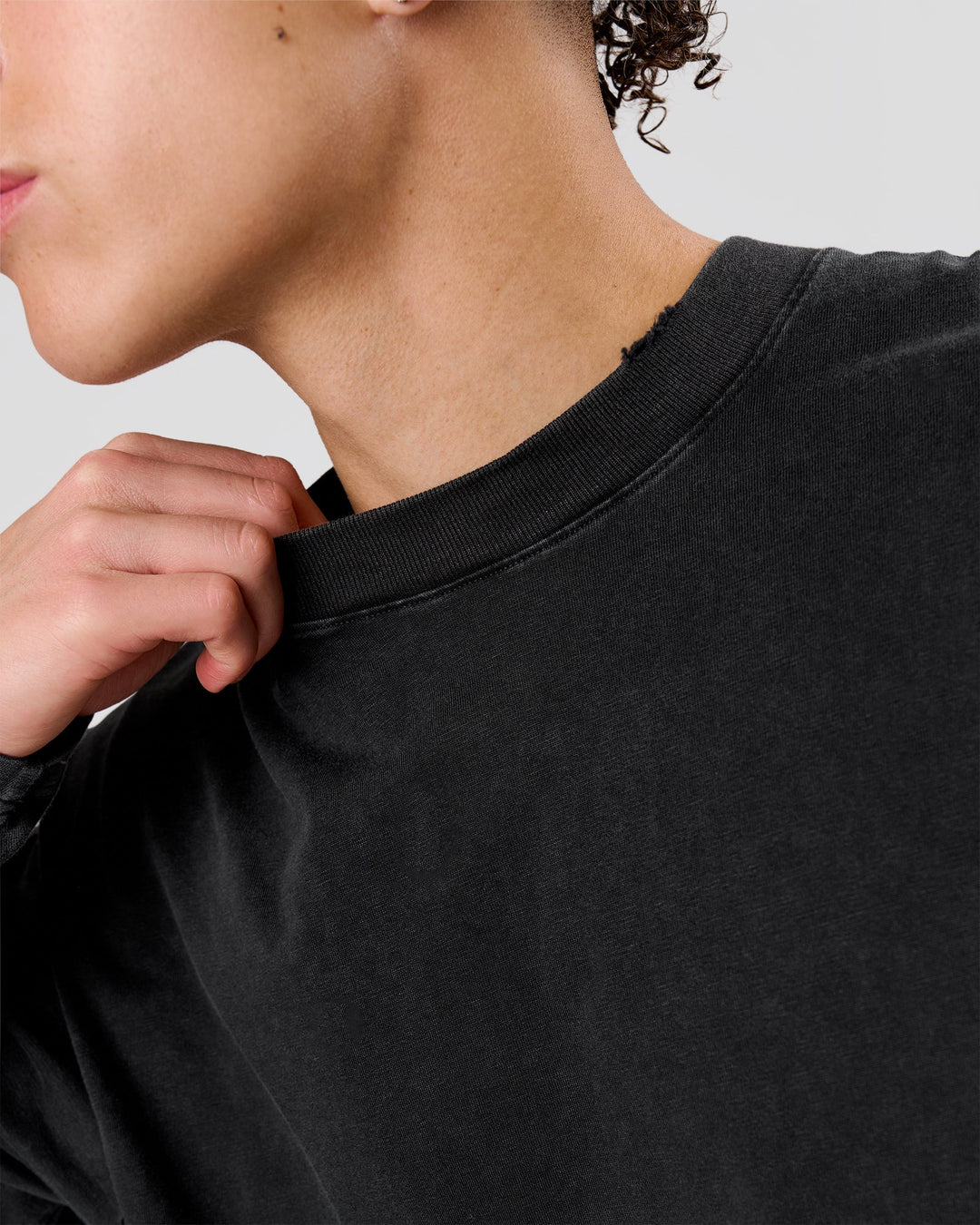 Man wearing Backline Washed Heavyweight Oversized LS Tee - Black Washed | Model:Leandro | Size:M - view 5