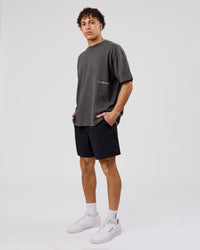 Man wearing Backline Washed Heavyweight Oversized Tee - Asphalt Washed | Model:Leandro | Size:M | Thumbnail Index: 4