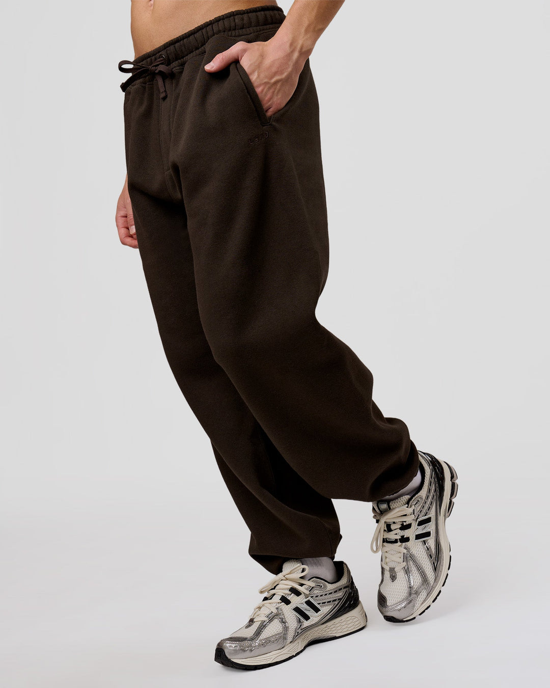 Man wearing Base Baggy Cuffed Track Pant - Ground Coffee | Model:Leandro | Size:M - view 3