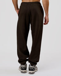 Man wearing Base Baggy Cuffed Track Pant - Ground Coffee | Model:Leandro | Size:M | Thumbnail Index: 4