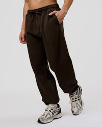 Man wearing Base Baggy Cuffed Track Pant - Ground Coffee | Model:Leandro | Size:M | Thumbnail Index: 8