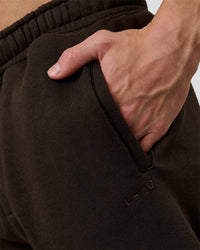 Man wearing Base Baggy Cuffed Track Pant - Ground Coffee | Model:Leandro | Size:M | Thumbnail Index: 9
