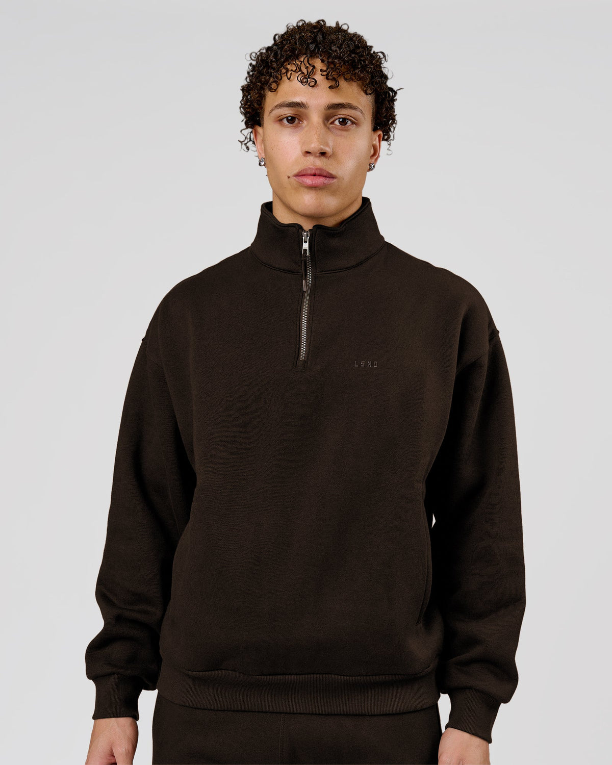 Man wearing Base Quarter Zip Sweater - Ground Coffee | Model:Leandro | Size:M - view 1