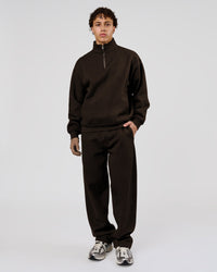 Man wearing Base Quarter Zip Sweater - Ground Coffee | Model:Leandro | Size:M | Thumbnail Index: 1