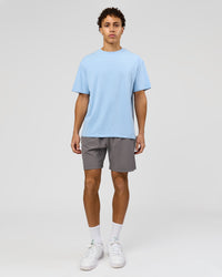 Man wearing Benchmark FLXCotton Oversized Tee - Open Air-Blue Bell | Model:Leandro | Size:M