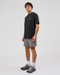 Man wearing Blended FLXCotton Oversize Tee  - Black Washed | Model:Leandro | Size:M | Thumbnail Index: 13