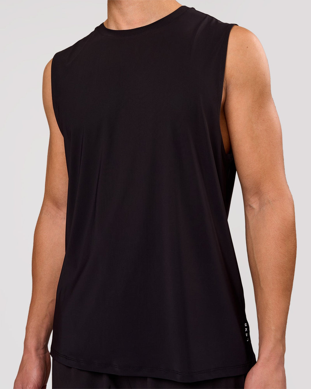Man wearing Cadence MicroMotion Muscle Tank - Black | Model:Leandro | Size:M - view 1