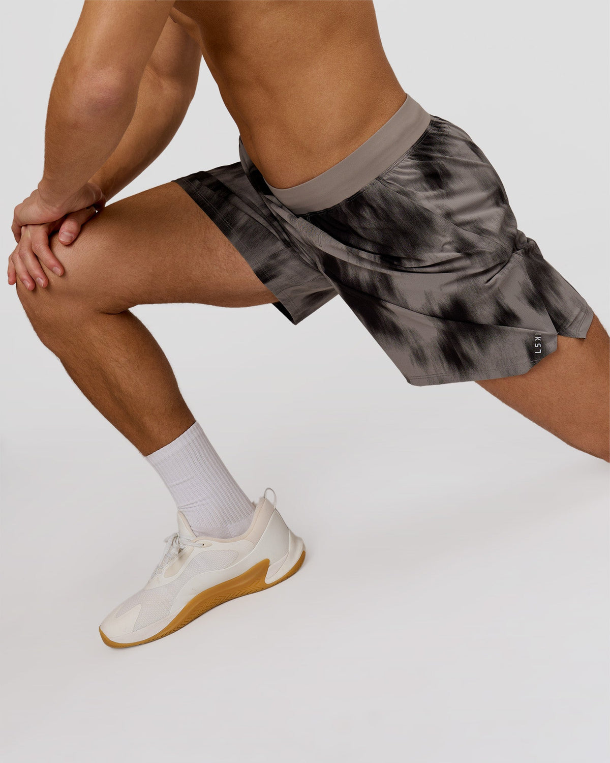 Man wearing Functional Training 7" Short - Bitmap Blur Storm Front | Model:Leandro | Size:M
