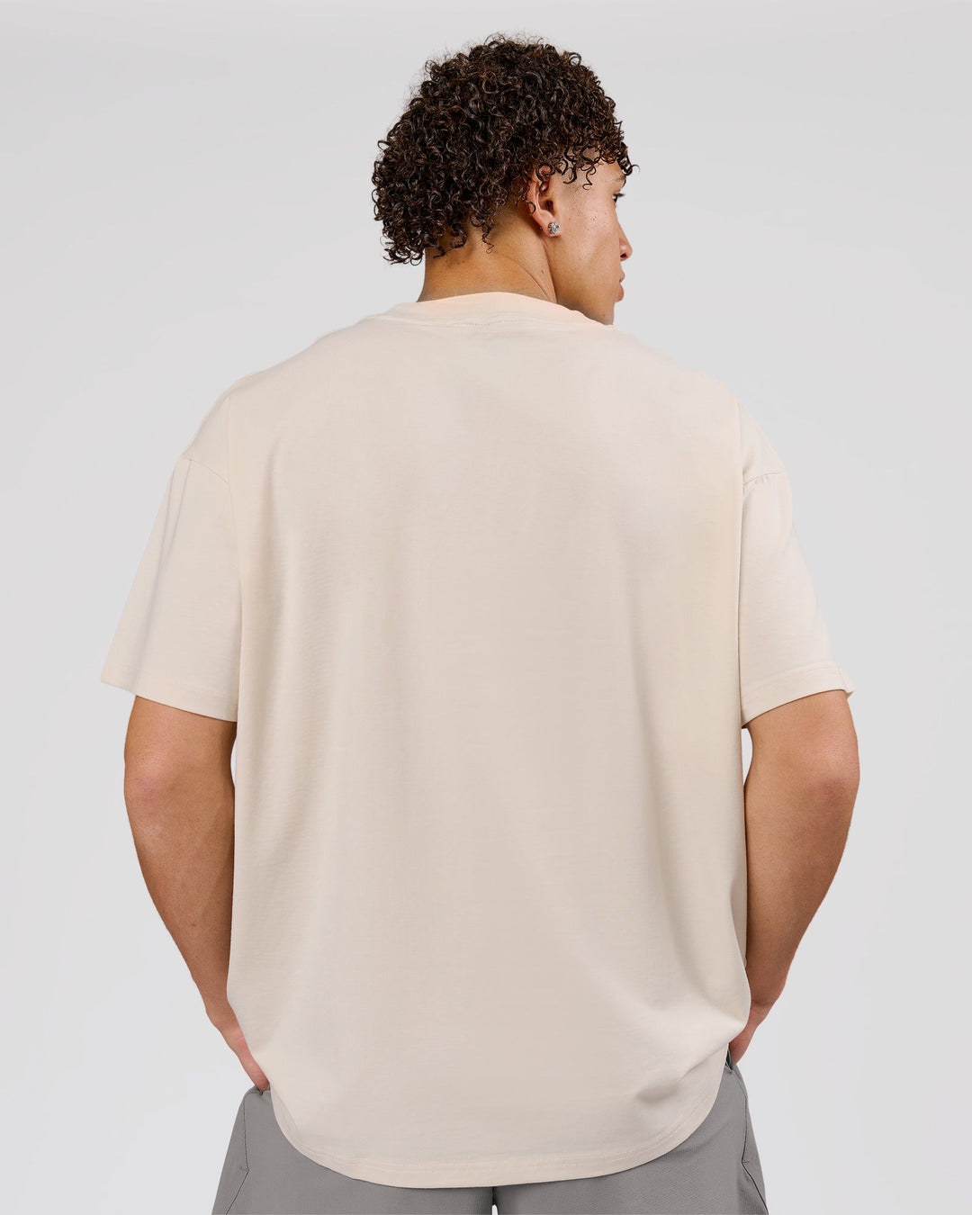 Man wearing Game Plan Heavyweight FLXCotton Oversized Tee - Vanilla Bean | Model:Leandro | Size:M - view 3