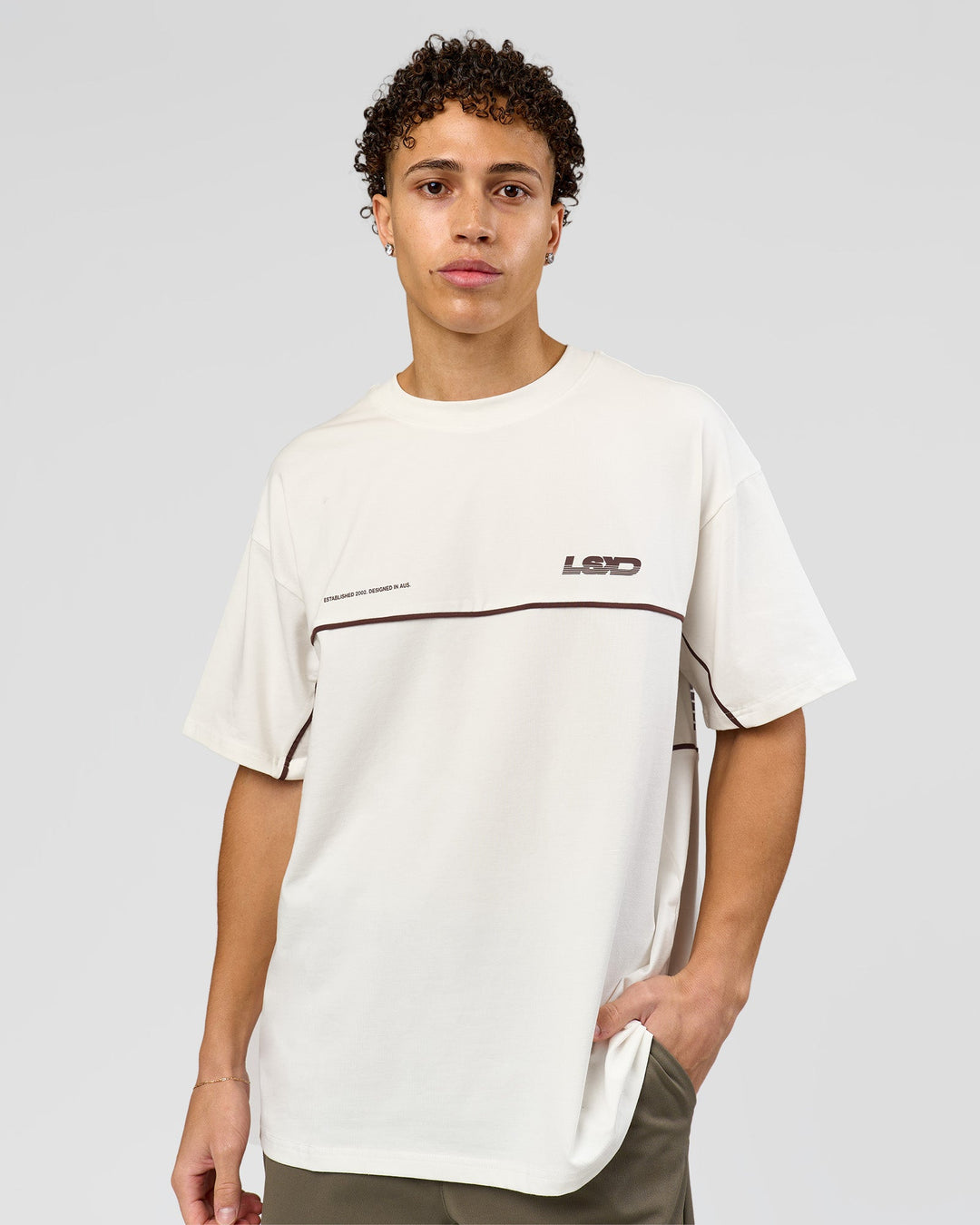Man wearing Inline Heavyweight FLXCotton Oversized Tee - Off White-Hot Chocolate | Model:Leandro | Size:M - view 5