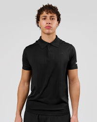 Man wearing Movember x LSKD Drive Seamless Polo - Black | Model:Leandro | Size:M | Thumbnail Index: 0