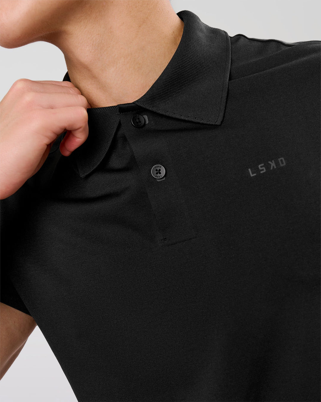 Man wearing Movember x LSKD Drive Seamless Polo - Black | Model:Leandro | Size:M - view 9