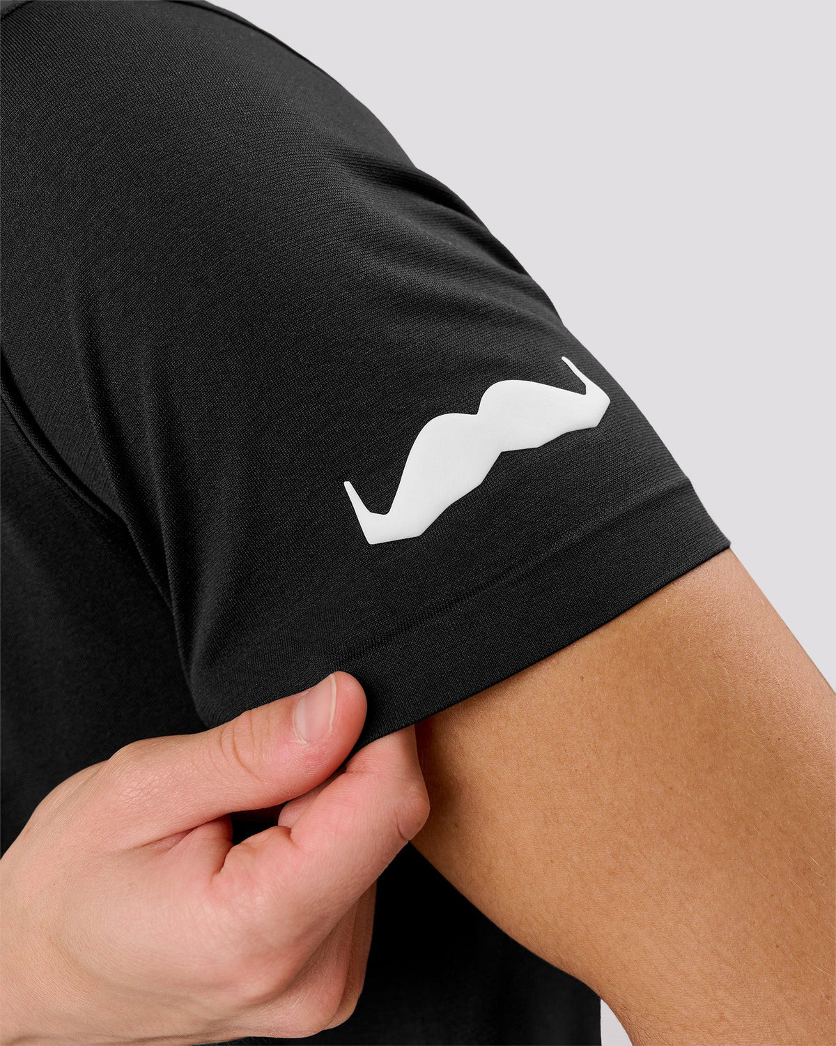 Man wearing Movember x LSKD Drive Seamless Polo - Black | Model:Leandro | Size:M - view 2