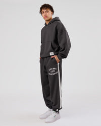 Man wearing Playbook Baggy Cuffed Track Pant - Onyx-Off White | Model:Leandro | Size:M | Thumbnail Index: 4