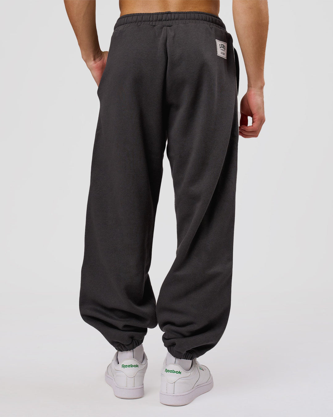 Man wearing Playbook Baggy Cuffed Track Pant - Onyx-Off White | Model:Leandro | Size:M - view 7