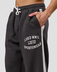 Man wearing Playbook Baggy Cuffed Track Pant - Onyx-Off White | Model:Leandro | Size:M | Thumbnail Index: 12