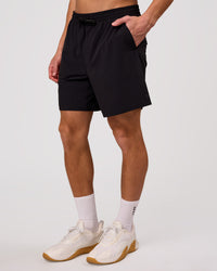 Man wearing Rep Movement 7" Training Short - Black | Model:Leandro | Size:M | Thumbnail Index: 6