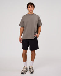 Man wearing Shadow Mark Heavyweight Oversized Tee - Storm Front-Onyx | Model:Leandro | Size:M | Thumbnail Index: 9