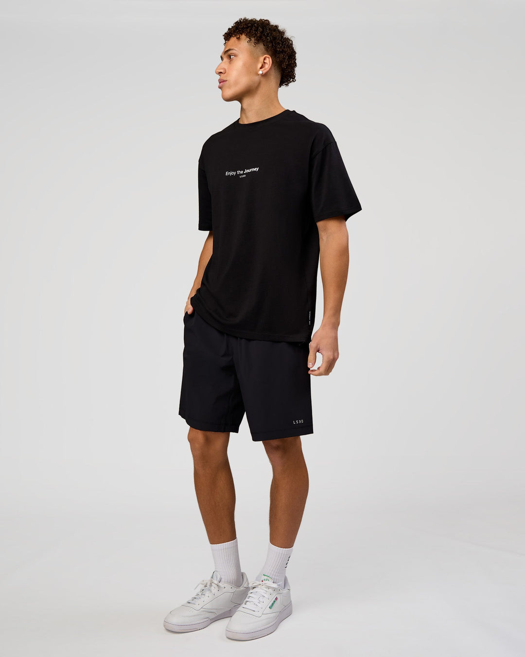 Man wearing VS1 Enjoy The Journey FLXCotton Oversize Tee - Black | Model:Leandro | Size:M - view 6
