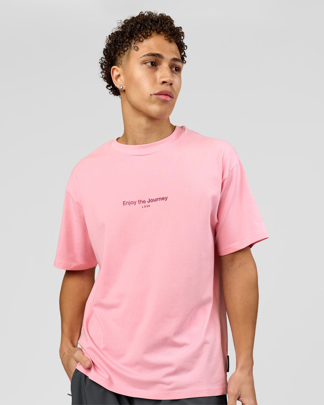 Man wearing VS1 Enjoy The Journey FLXCotton Oversize Tee - Pink Rose | Model:Leandro | Size:M - view 2