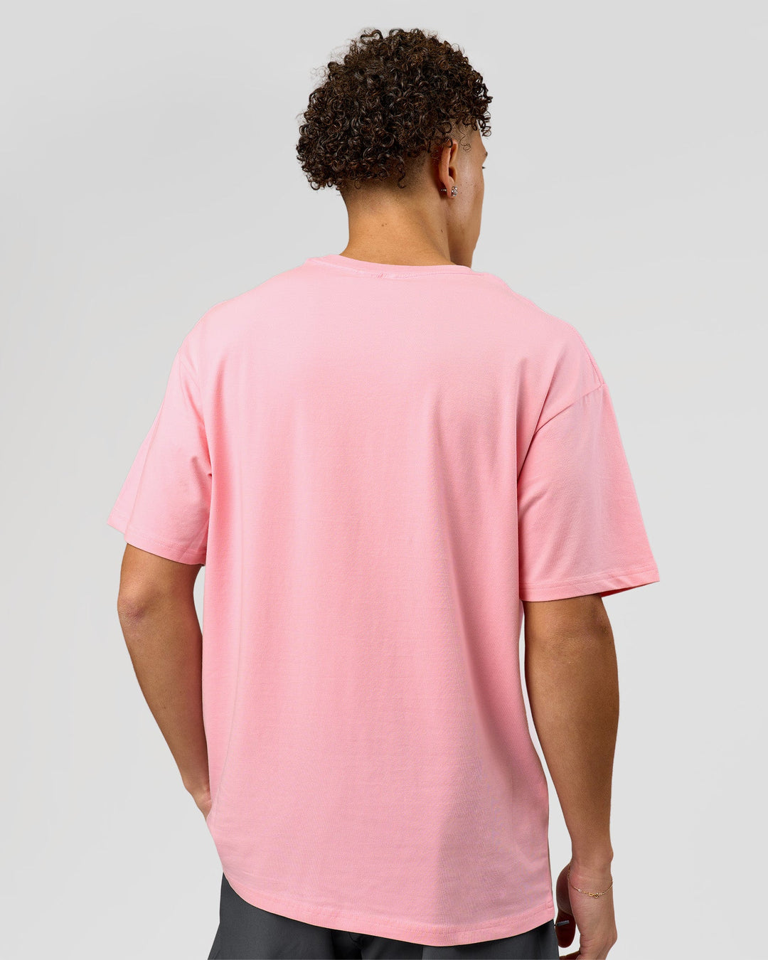 Man wearing VS1 Enjoy The Journey FLXCotton Oversize Tee - Pink Rose | Model:Leandro | Size:M - view 6