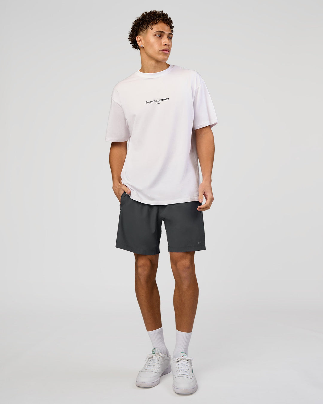 Man wearing VS1 Enjoy The Journey FLXCotton Oversize Tee - White | Model:Leandro | Size:M - view 9