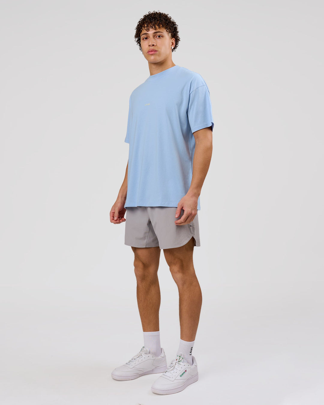 Man wearing VS26 Journey FLXCotton Oversize Tee - Open Air-Lemon | Model:Leandro | Size:M - view 11