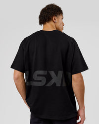 Man wearing Shadow Mark Heavyweight Oversized Tee - Black-Onyx | Model:Leandro | Size:M | Thumbnail Index: 1