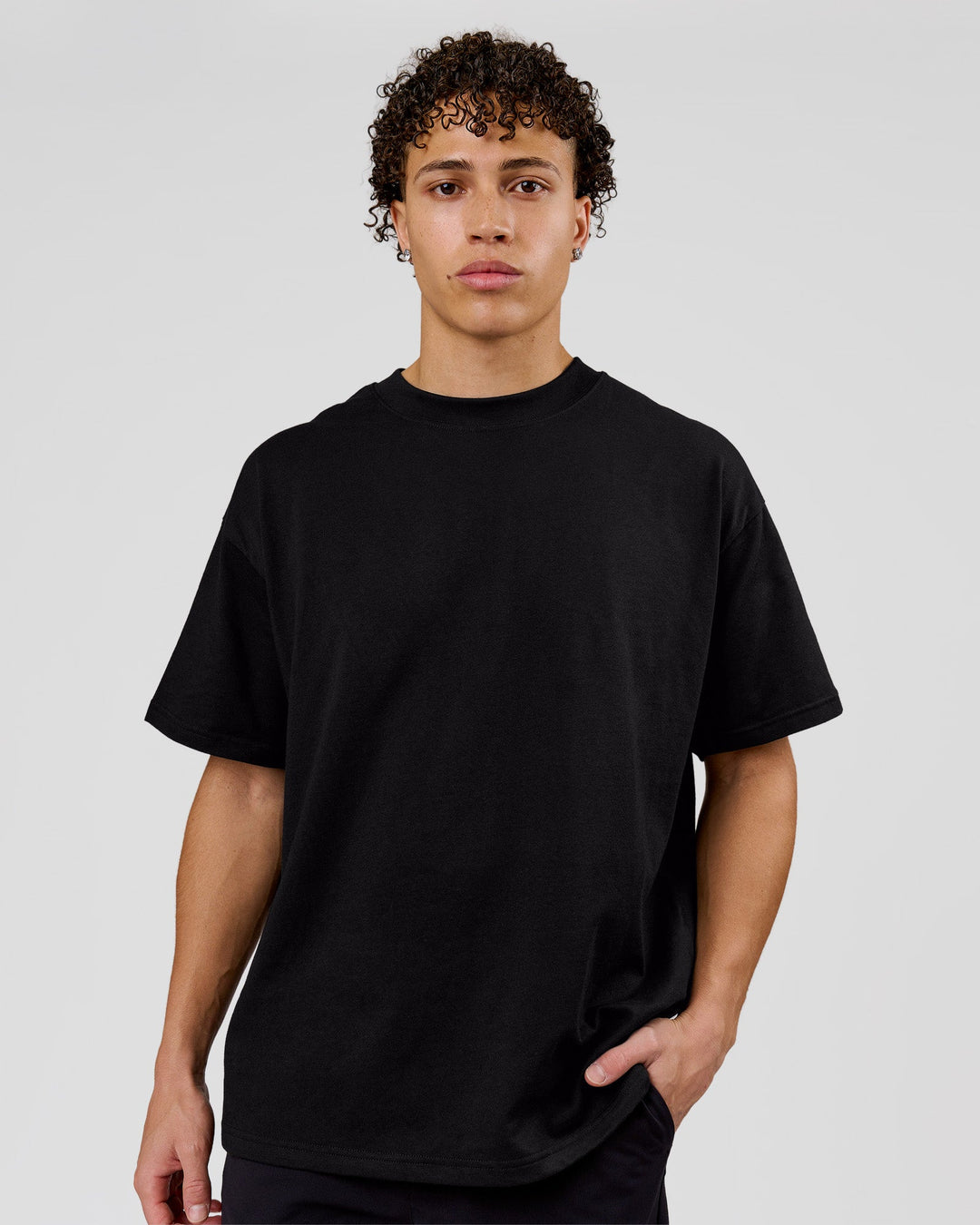 Man wearing Shadow Mark Heavyweight Oversized Tee - Black-Onyx | Model:Leandro | Size:M - view 5