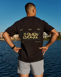 Man wearing Benchmark FLXCotton Oversized Tee - Onyx-Yellow Fizz | Thumbnail Index: 11