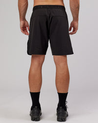 Man wearing Competition 8" Performance Short - Black
