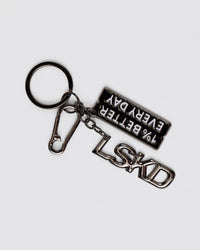 Studio image of 1% Better Key Ring - Black-Gun Metal | Thumbnail Index: 0