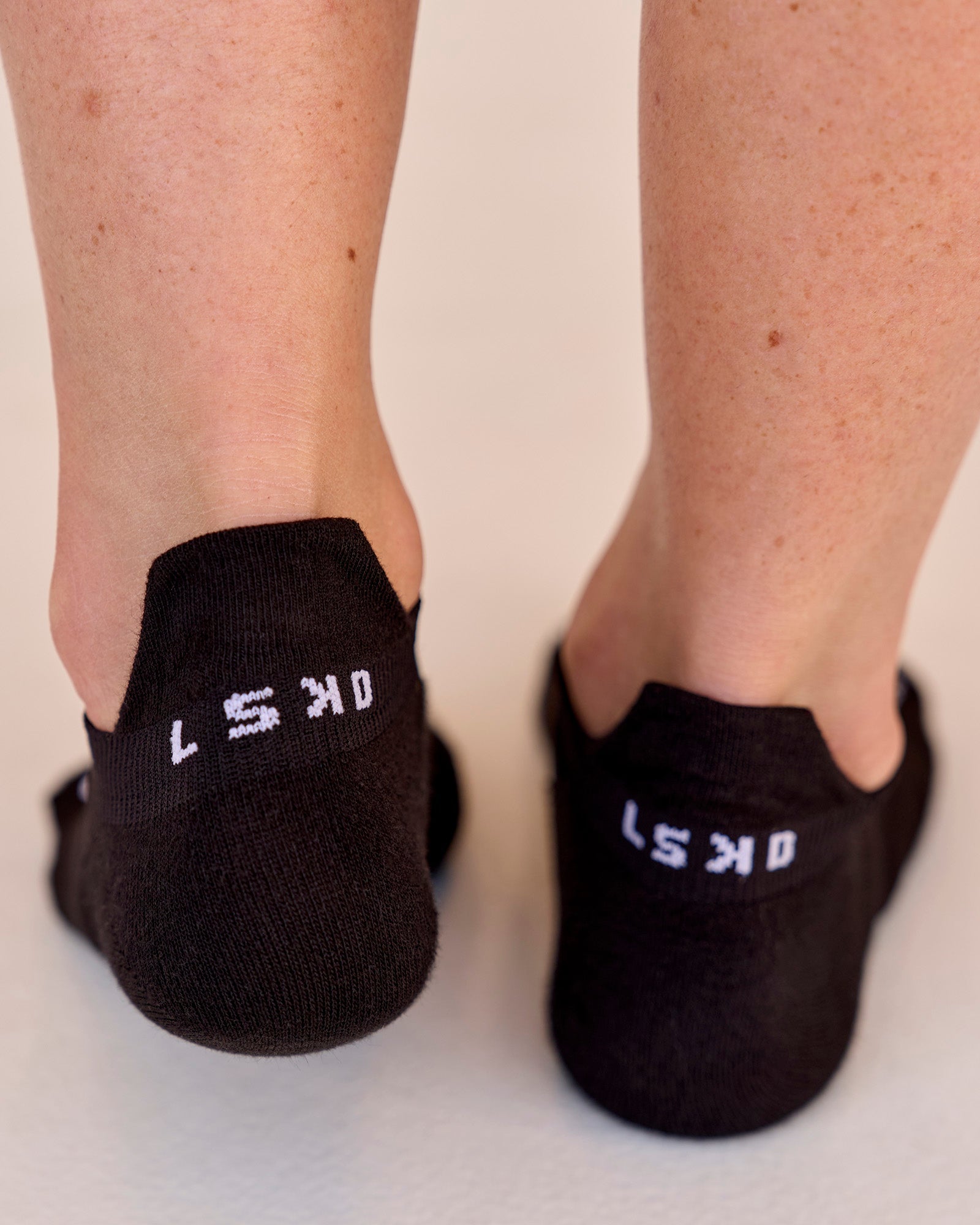 Studio image of Accelerate Performance Ankle Socks - Black-White