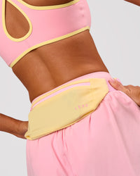 Studio image of Accelerate Run Belt - Lemon-Pink Rose | Thumbnail Index: 0