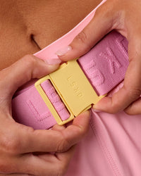 Studio image of Accelerate Run Belt - Lemon-Pink Rose | Thumbnail Index: 4
