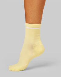 Studio image of Fast Performance Quarter Socks 2.0 - Lemon-White | Thumbnail Index: 0