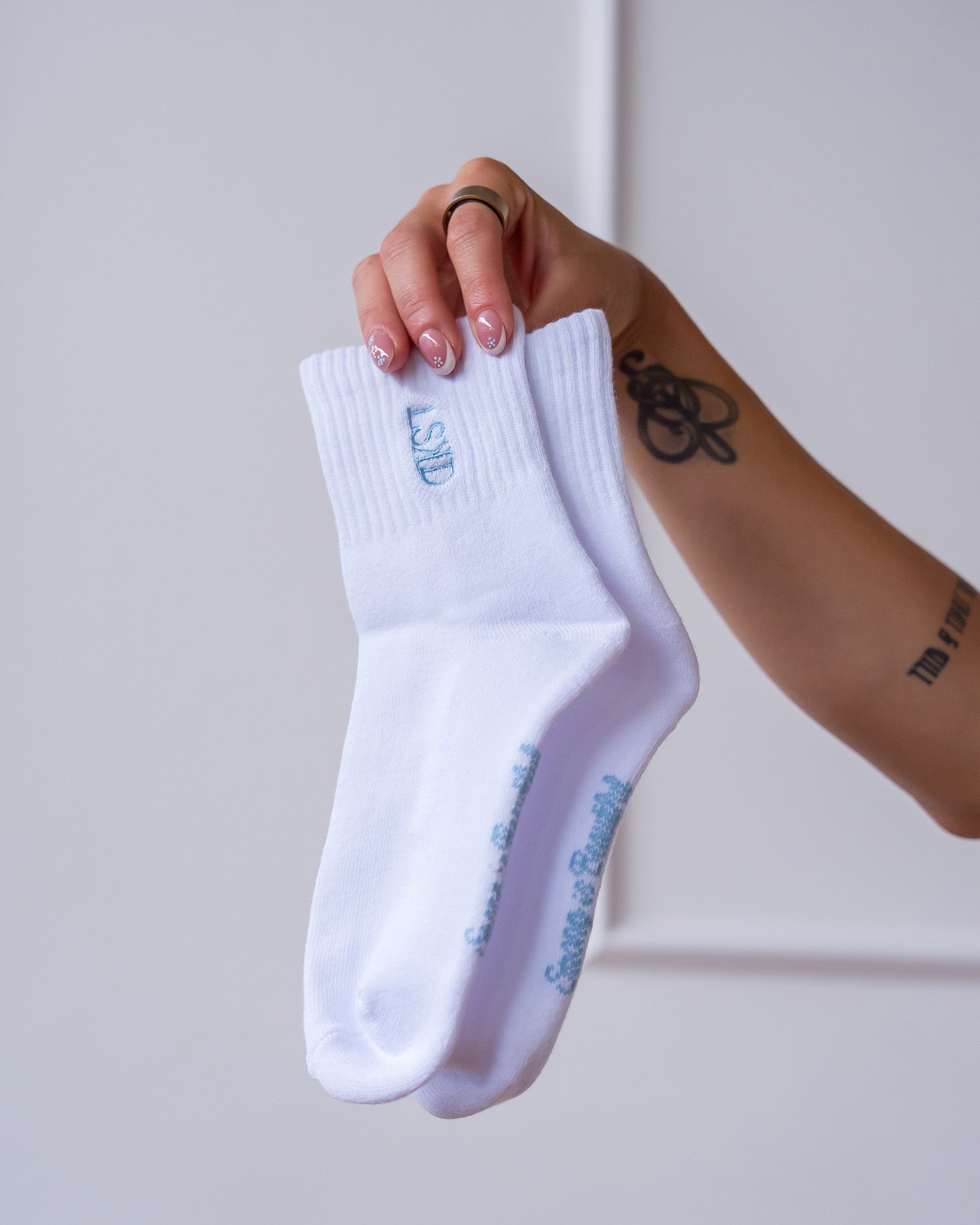 Studio image of Strong is Beautiful Quarter Socks - White-Open Air