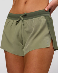 Woman wearing Accelerate 3" Mid-Rise Running Short - Pure Olive-Fog | Model:Xs | Size:ISSY | Thumbnail Index: 0