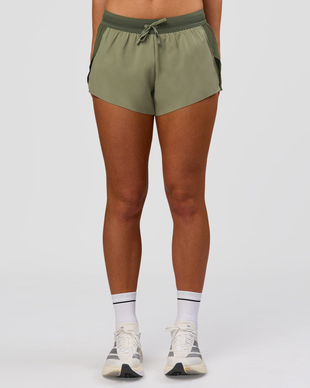 Woman wearing Accelerate 3" Mid-Rise Running Short - Pure Olive-Fog | Model:Xs | Size:ISSY - view 5