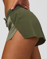 Woman wearing Accelerate 3" Mid-Rise Running Short - Pure Olive-Fog | Model:Xs | Size:ISSY | Thumbnail Index: 10