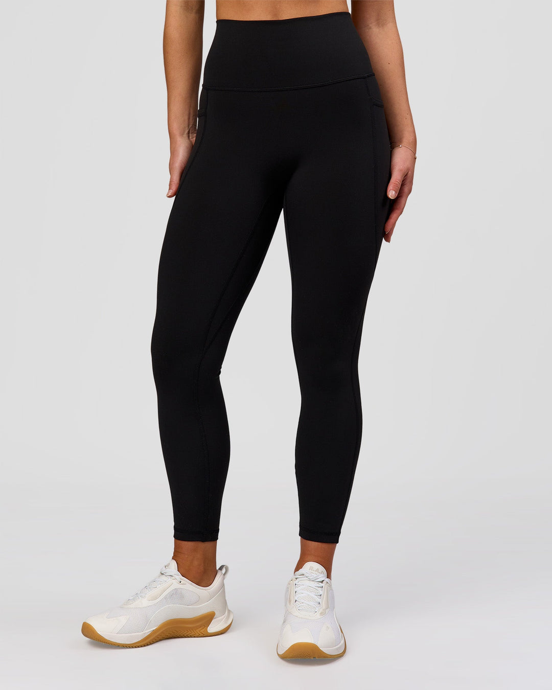 Woman wearing Fusion O.G Ultra High-Rise 7/8 Legging Pockets - Black | Model:Xs | Size:ISSY - view 1