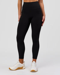 Woman wearing Fusion O.G Ultra High-Rise 7/8 Legging Pockets - Black | Model:Xs | Size:ISSY | Thumbnail Index: 0